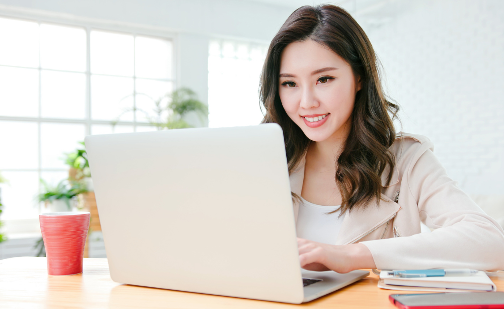 young woman looking at laptop screen