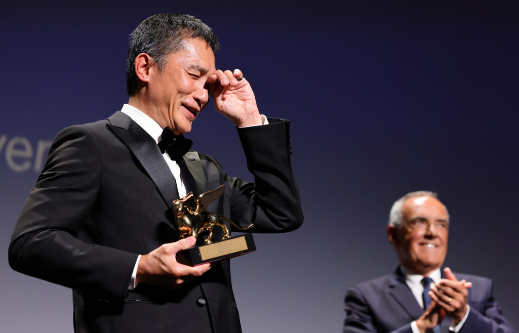 Tony Leung onstage emotional during acceptance speech